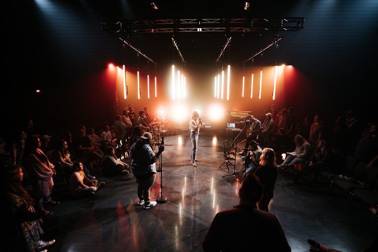 Intimate stage lit in tight warm specials