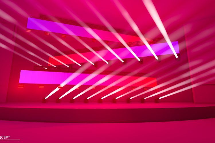Hard magenta beams raking across the stage